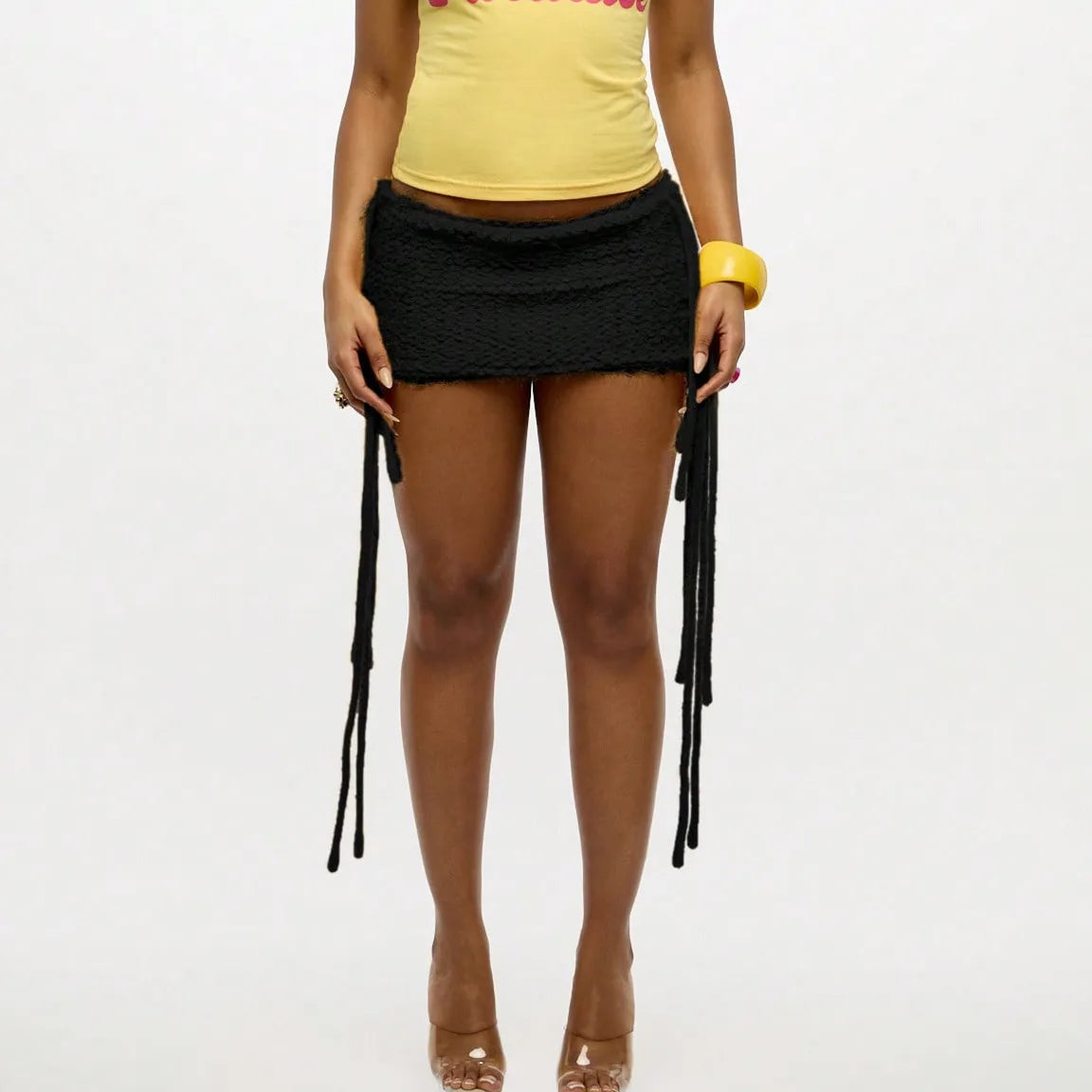 Women Textured Knit Mini Skirt Summer Fashion Solid Color Low Rise Short Skirts with Long Fringe Side Ties and Raw Edges